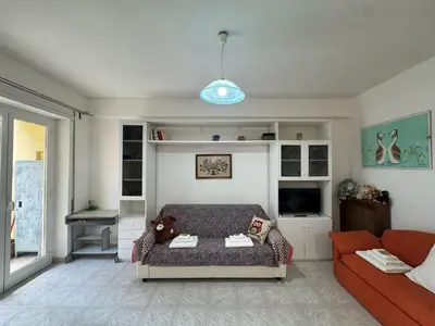 a living room with a couch and a tv at Studio in the Green Roma in Rome