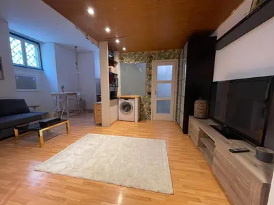 a living room with a large flat screen tv at AT Simone Cavallini in Rome