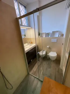 a bathroom with a toilet and a sink at AT Simone Cavallini in Rome