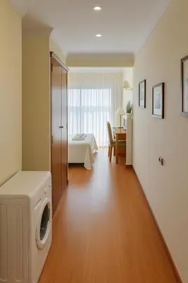 a living room with a washer and dryer in a room at TatyHouse in Rome