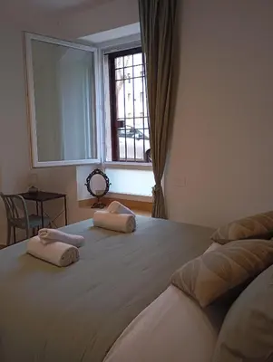 a bedroom with two beds with towels on them at Grazioso e moderno nuovo appartamento in Rome