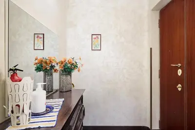 a room with two vases with flowers on a counter at Casa Tembien in Rome in Rome