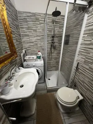a bathroom with a sink and a toilet and a shower at Machiavelli's House in Rome