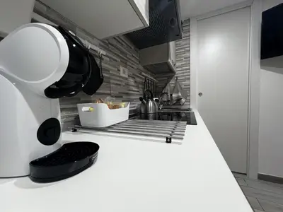 a kitchen with a white counter top with a mixer at Machiavelli's House in Rome
