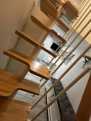 an overhead view of a staircase with wooden treads at Machiavelli's House in Rome