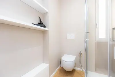 a bathroom with a toilet and a shower at Amazing Monteverde in Rome