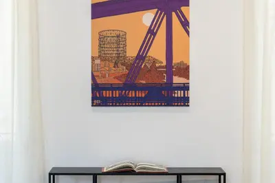a painting of a crane on a wall next to a book at Amazing Monteverde in Rome