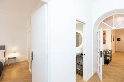 a room with a bed and an open door at Amazing Monteverde in Rome