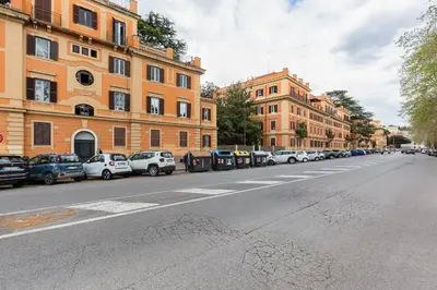 a city street with cars parked on the side of the road at Villa Riccio-Flaminio House in Rome