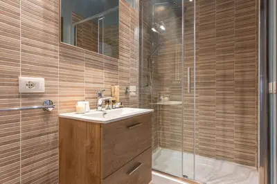 a bathroom with a sink and a shower at Guest House Colosseo Terrestre in Rome