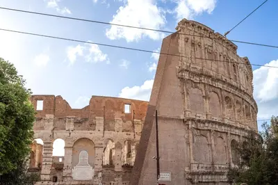 an old building with scaffolding on the side of it at Guest House Colosseo Terrestre in Rome