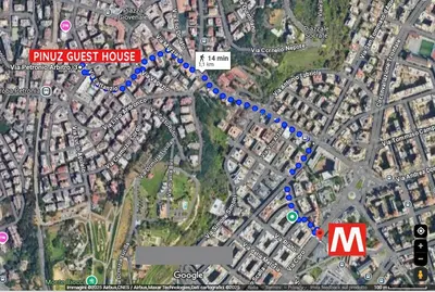a map of a pink guest house with blue dots at Pinuz Guest House in Rome