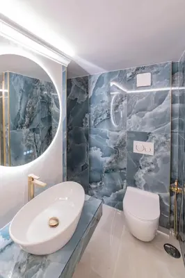 a bathroom with a white toilet and a sink at Heart of Rome - Pantheon View in Rome