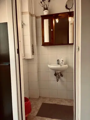 a bathroom with a sink and a mirror at Trastevere vibes in Rome