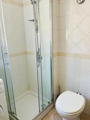 a bathroom with a shower and a toilet at Trastevere vibes in Rome