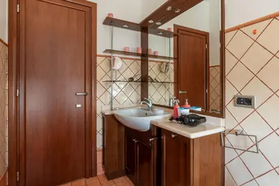 a bathroom with a sink and a mirror at GuestHost - Bright Apartment in Monteverde in Rome