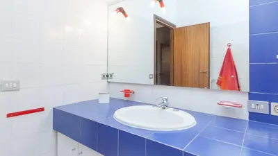 a bathroom with a sink and a mirror at Rental in Rome Santini apartment in Rome