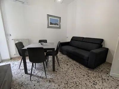 a living room with a couch and a table at Silvia Apartment in Rome