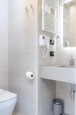 a bathroom with a sink and a toilet at Luma Rooms in Rome