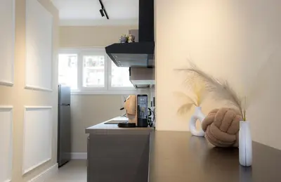 a kitchen with a stove and a counter top at Luma Rooms in Rome