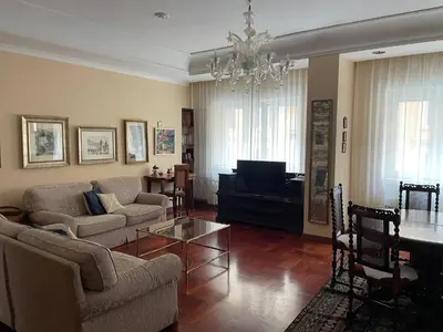 a living room with a couch and a table at Vatican Vibes - 5 minutes from the Pope in Rome