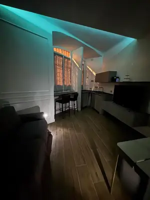 a living room with a couch and a table in it at Apartament Leutari in Rome