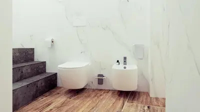 a white bathroom with a toilet and stairs at Apartament Leutari in Rome