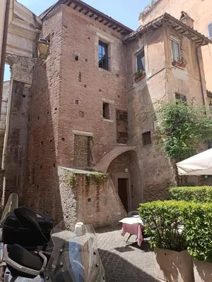 a large brick building with an archway in front of it at Ottavia apartment in Rome