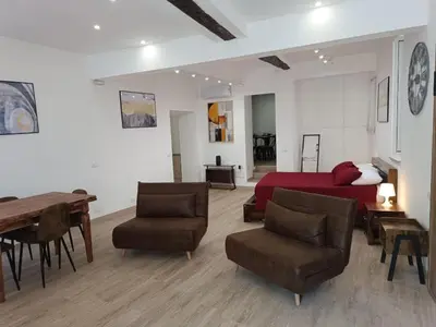 a bedroom with a bed and a table and chairs at Ottavia apartment in Rome