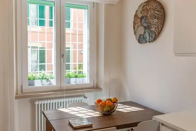 a kitchen with a table with a bowl of fruit on it at Baglivi 8 - Sapienza - Metro B in Rome
