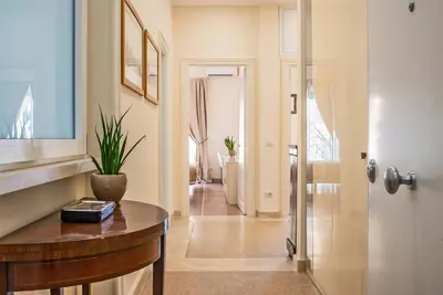 a hallway with a table with a plant on it at Baglivi 8 - Sapienza - Metro B in Rome