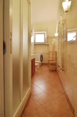 a bathroom with a toilet and a sink at The Sunny House of Rome in Rome