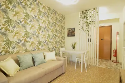a living room with a couch and a table at The Sunny House of Rome in Rome