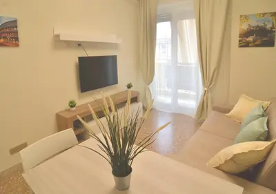 a living room with a couch and a table at The Sunny House of Rome in Rome