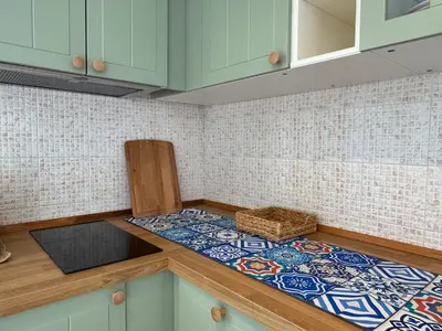 a kitchen with a counter top with a sink at Rooftop via Appia Nuova, Roma in Rome