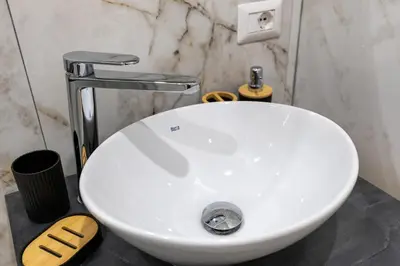 a white sink with a faucet in a bathroom at Hadrian's House in Rome