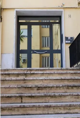 a door with stairs in front of a building at CaSa e Caffarella in Rome