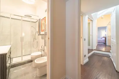 a bathroom with a toilet sink and a shower at Family Retreat in the Heart of the Ghetto by Houseeds in Rome