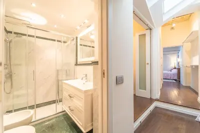 a bathroom with a shower and a sink at Family Retreat in the Heart of the Ghetto by Houseeds in Rome