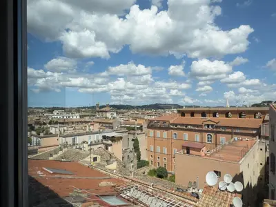a view of a city from a window at Chasing the Stars Spanish Steps Boutique Suite in Rome