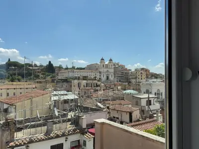 a view of a city from a window at Chasing the Stars Spanish Steps Boutique Suite in Rome