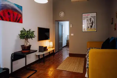 a living room with a couch and a tv at Navona Boutique Apartment with terrace in Rome