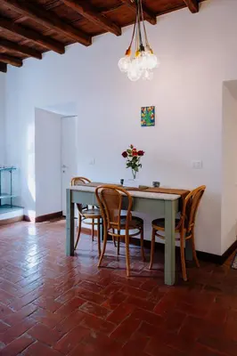 a dining room with a table and chairs at Navona Boutique Apartment with terrace in Rome