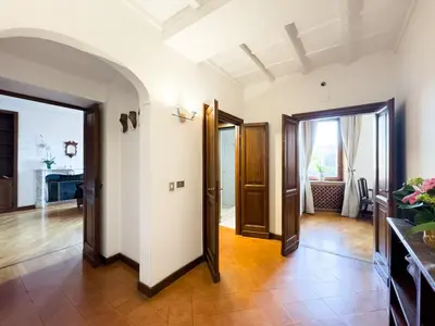 a hallway with two doors and a room with a floor at Maison Giulia in Rome