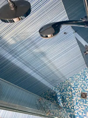 a ceiling of a bathroom with two lights and a toilet at Domus Pacis in Rome