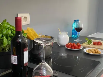 a bottle of wine and a glass on a counter at Domus Pacis in Rome