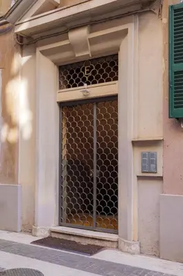 a window of a building with a lot of windows at Labicana - Rome Apartment in Rome