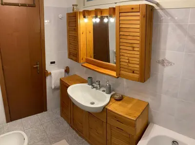 a bathroom with a sink and a mirror at Casa Ferrari in Rome