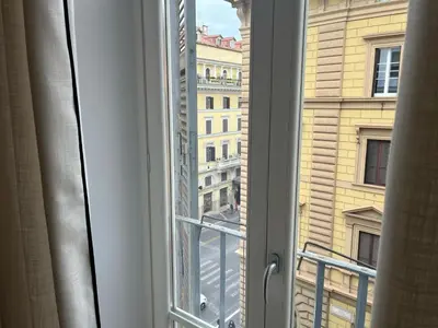 a window with a view of a building at Piazza Venezia Luxe Apartment in Rome