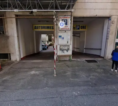 an empty parking garage with a parking sign in it at Re di Roma vacation in Rome